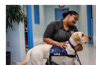 Correctional officer petting Flossy